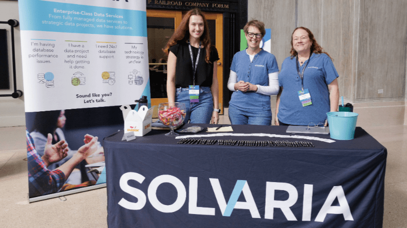 Three women at a Solvaria booth