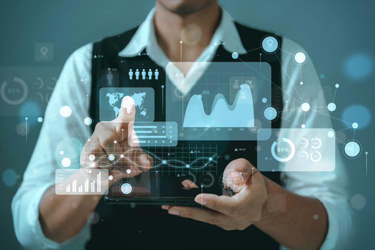 A person in business attire uses a tablet with holographic data charts, graphs, and analytics icons projected above the device, representing digital technology, Business Intelligence, and advanced data analysis.