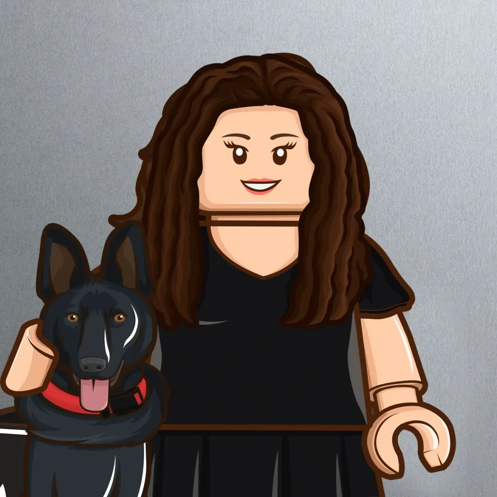 LEGO-style figure of a woman with long brown hair wearing a black dress, smiling, with one arm around a black dog with upright ears and a red collar, both in front of a plain gray background.